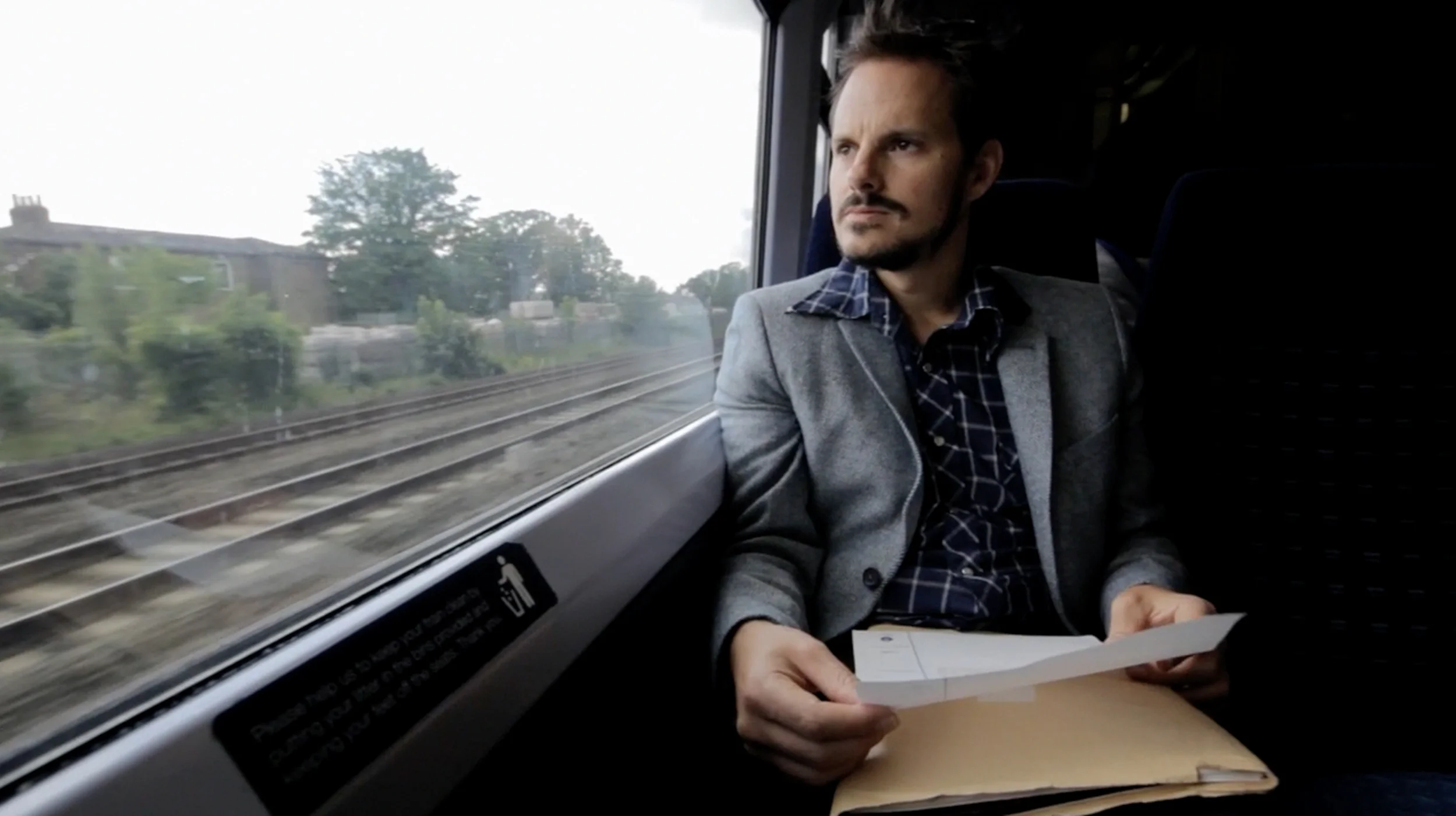 Andrew on a train