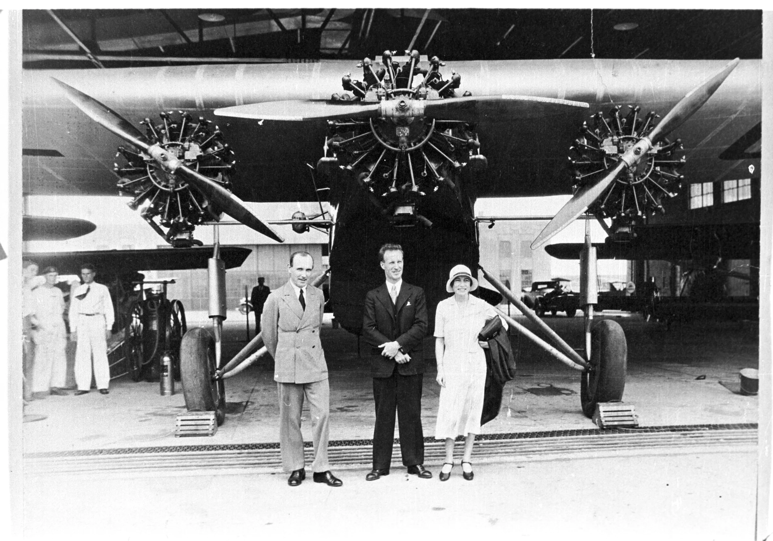Bill, Charles Kingsford-Smith and Chubbie in front of the Southern Cross